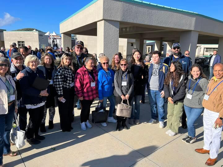 Photo showing a group of Rotary members at a school